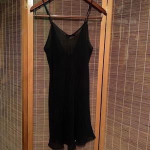 Sheer black slip with satin bows along the back. Cute black lingerie